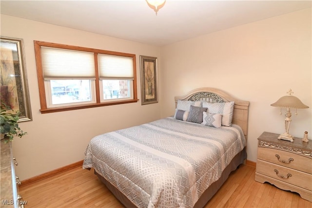 bedroom with light hardwood / wood-style flooring