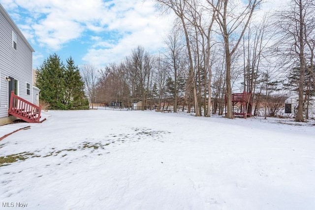 view of yard covered in snow