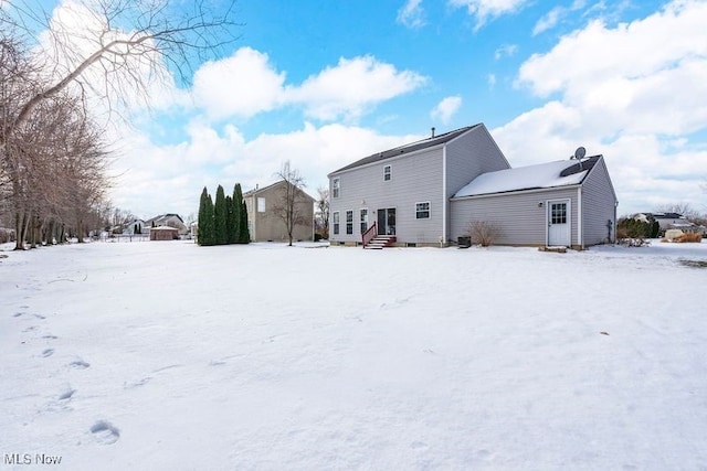 view of snow covered property