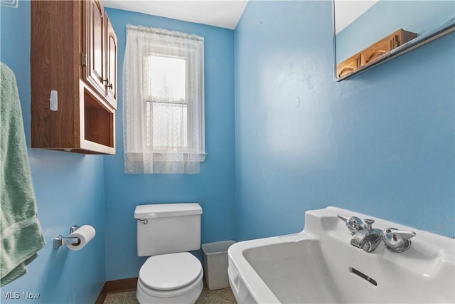 bathroom with sink and toilet