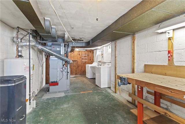 basement with separate washer and dryer, heating unit, and gas water heater