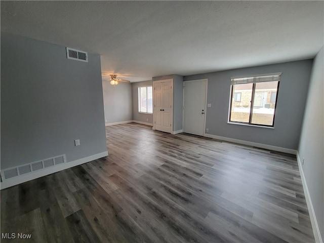 interior space with hardwood / wood-style flooring and ceiling fan