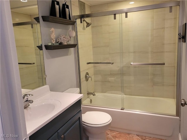 full bathroom with enclosed tub / shower combo, vanity, tile patterned floors, and toilet