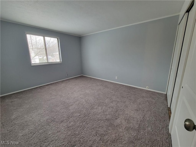 empty room with carpet floors and ornamental molding