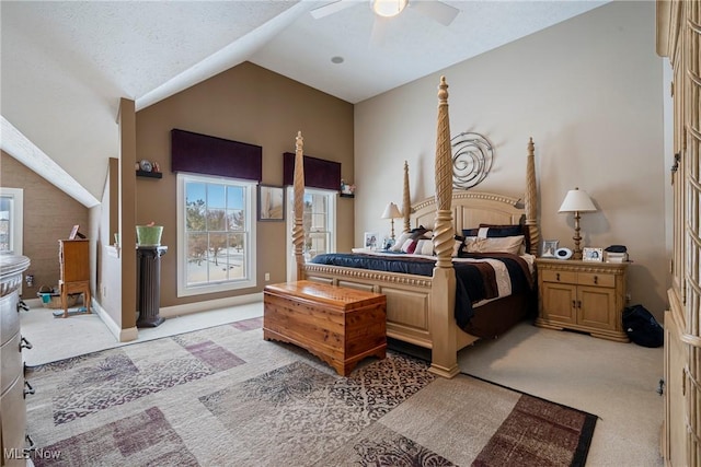 bedroom with ceiling fan, lofted ceiling, light carpet, and a textured ceiling