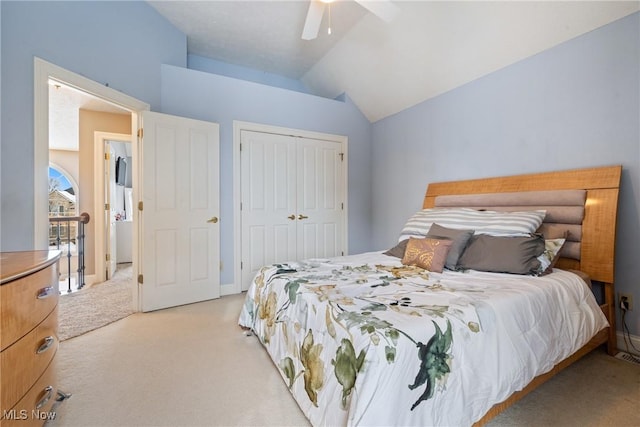 bedroom featuring vaulted ceiling, ceiling fan, and light colored carpet