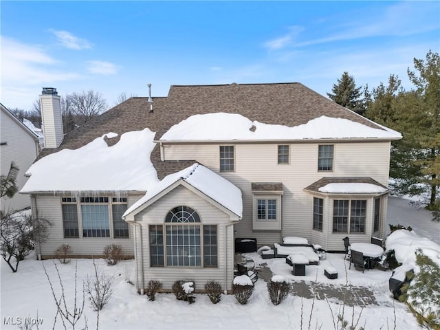 view of snow covered house