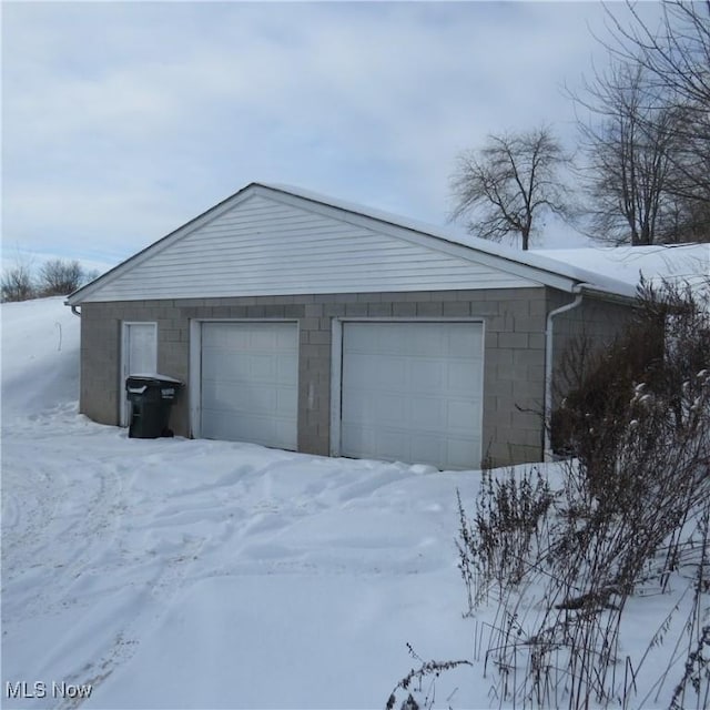 view of snow covered garage