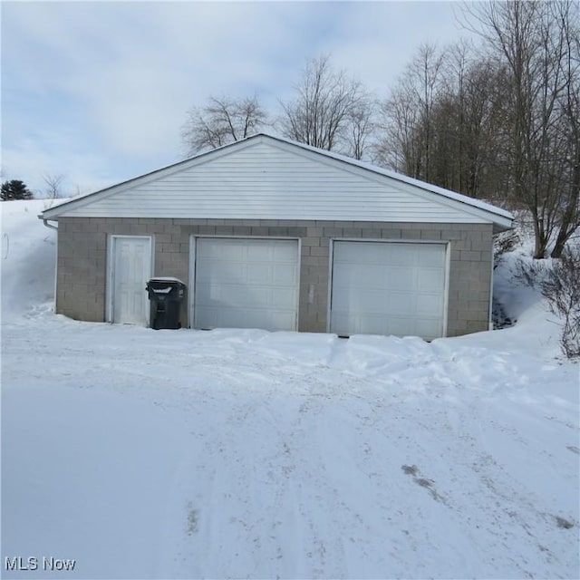 view of snow covered garage