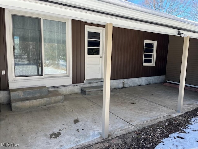 property entrance with a patio area