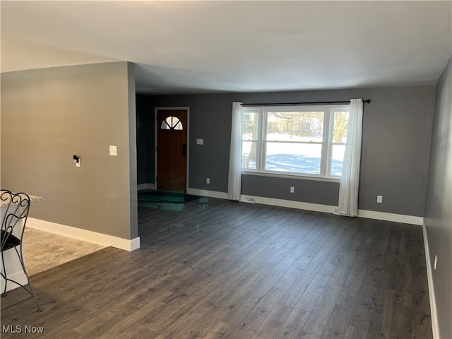 interior space with dark hardwood / wood-style floors