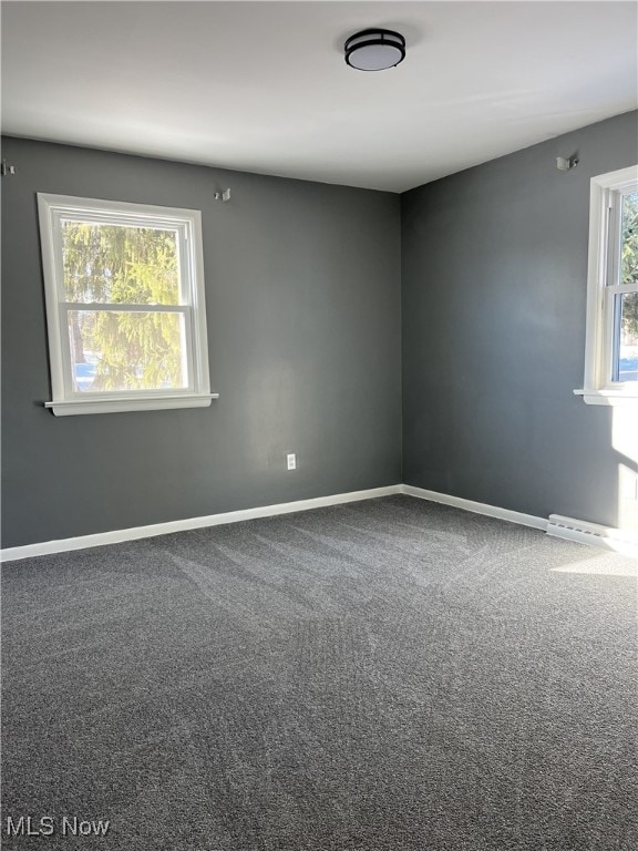 unfurnished room featuring carpet flooring