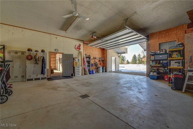 garage featuring ceiling fan and a garage door opener