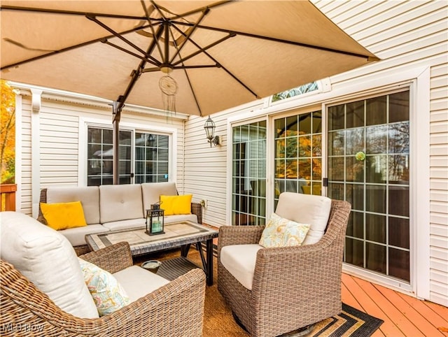 wooden deck with an outdoor living space