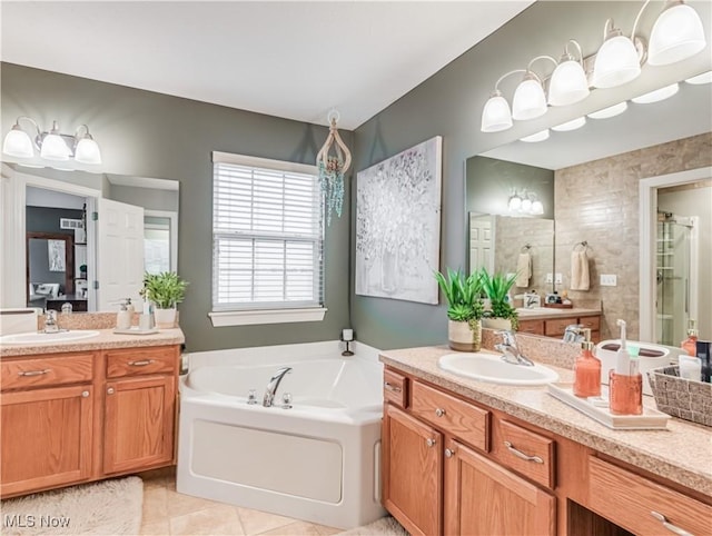 bathroom with tile patterned flooring, vanity, and independent shower and bath