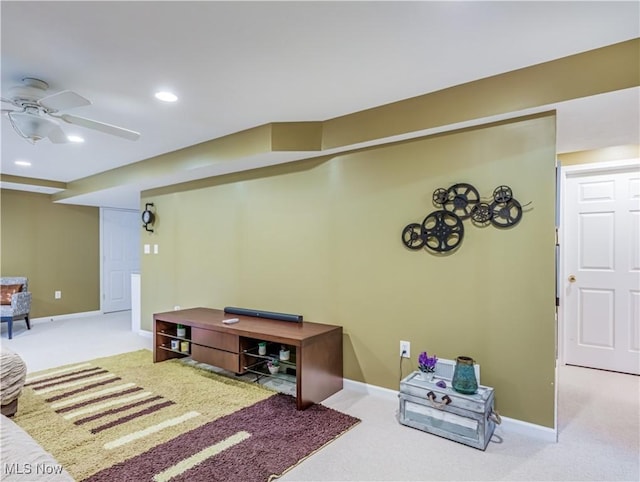 carpeted living room featuring ceiling fan