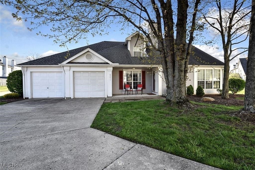 view of front of property with a garage and a front yard