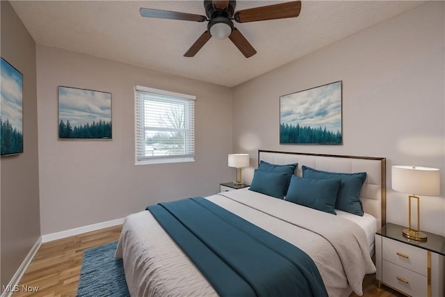 bedroom featuring ceiling fan and light hardwood / wood-style floors