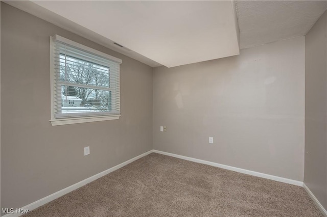 unfurnished room featuring carpet floors