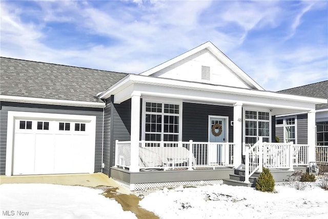 view of front of house with a garage and covered porch