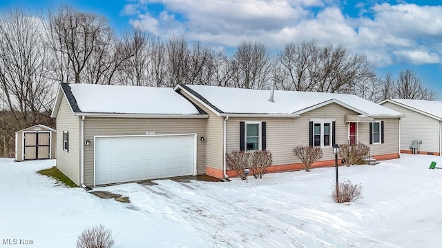 single story home with a garage and a storage unit