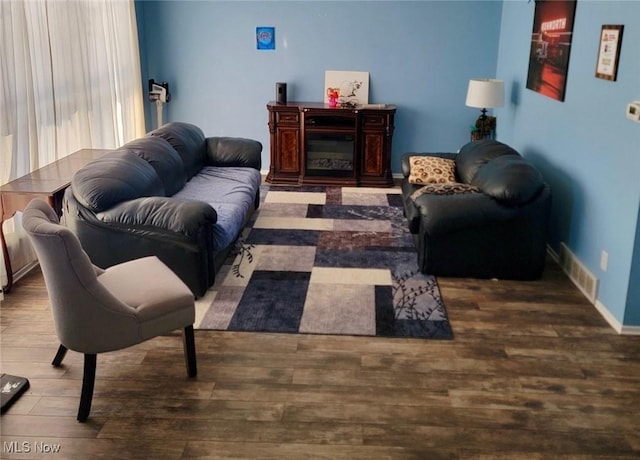 living room with dark hardwood / wood-style floors