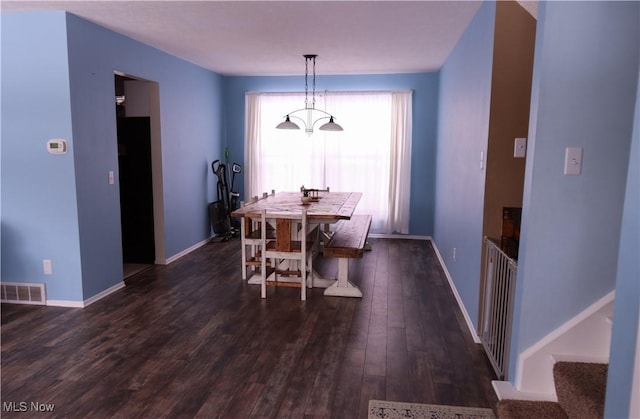 dining area featuring dark hardwood / wood-style flooring