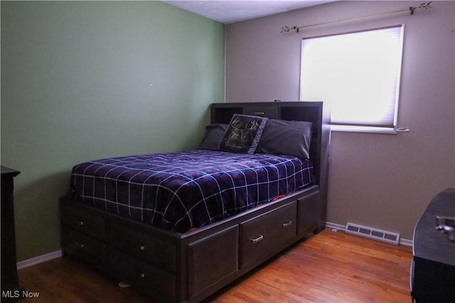 bedroom featuring light hardwood / wood-style flooring