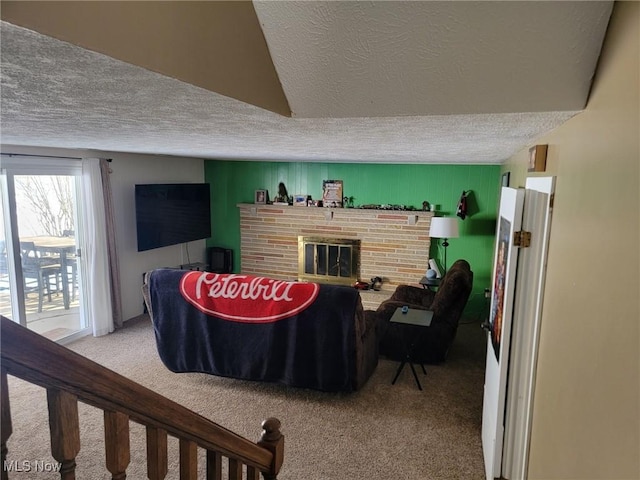 carpeted living room with lofted ceiling, a brick fireplace, and a textured ceiling