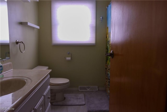 bathroom with vanity and toilet