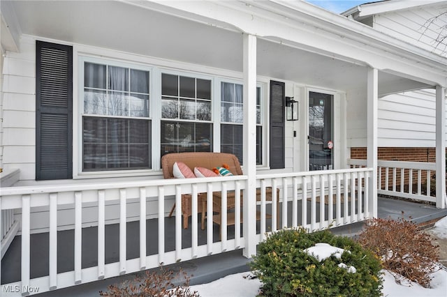 entrance to property featuring covered porch