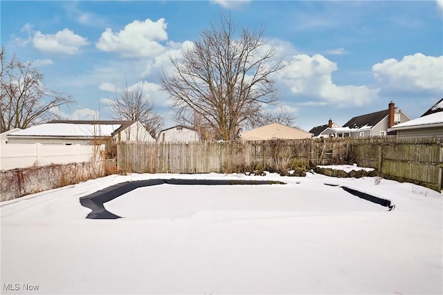 view of yard covered in snow