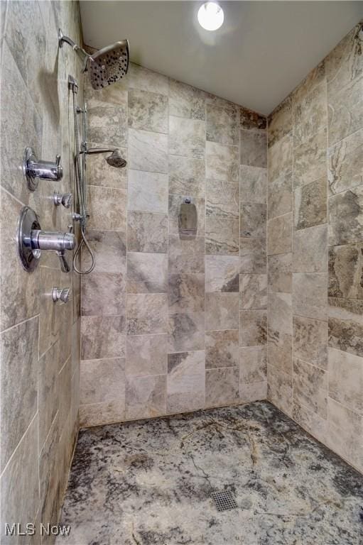 bathroom with tiled shower