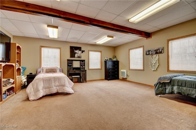 carpeted bedroom with a paneled ceiling