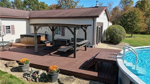 deck featuring a swimming pool with hot tub and a pergola