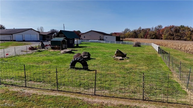 view of yard with a rural view