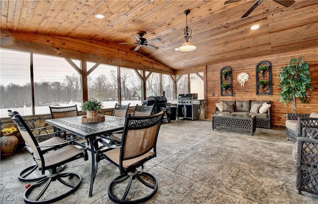 sunroom / solarium with ceiling fan, lofted ceiling, and wood ceiling