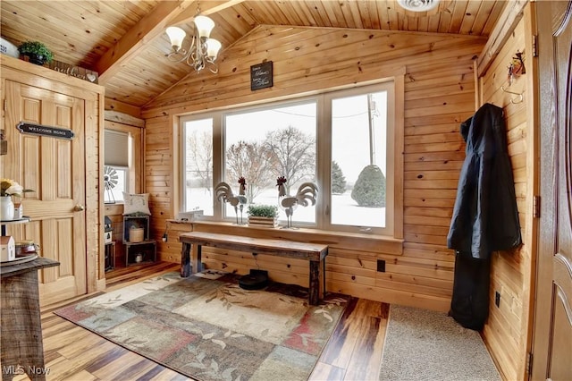 interior space featuring wood-type flooring, wooden ceiling, vaulted ceiling, and wood walls