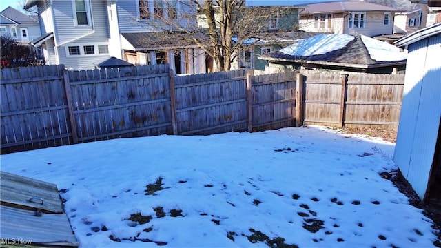 view of yard covered in snow