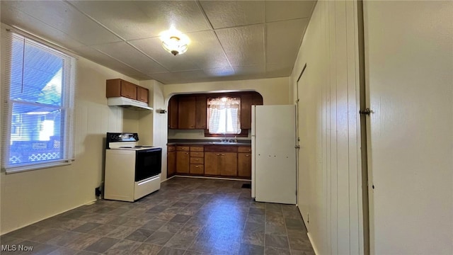 kitchen featuring sink and white appliances