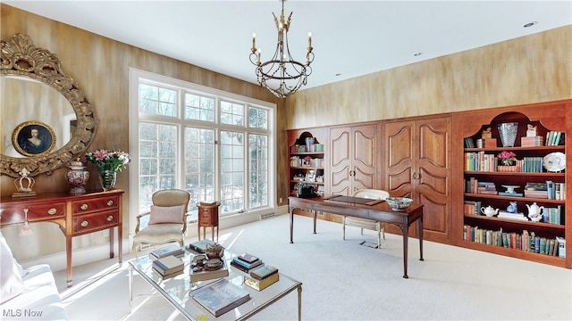 home office with light colored carpet, a chandelier, and wood walls