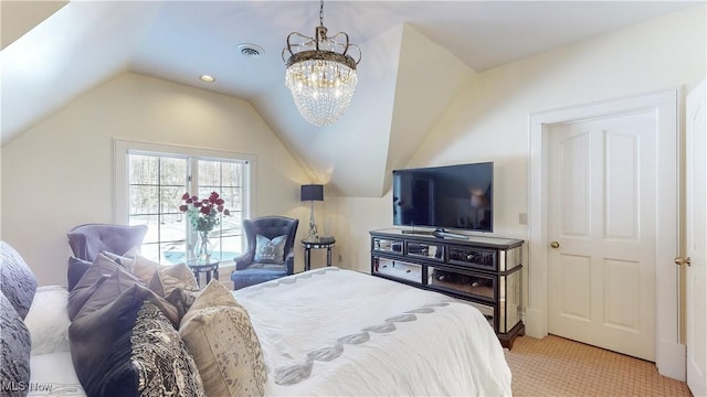 carpeted bedroom featuring an inviting chandelier and vaulted ceiling