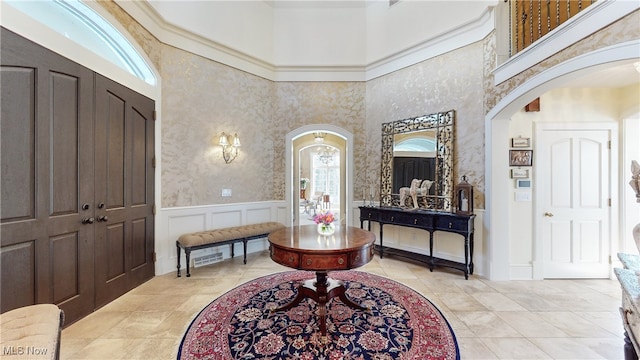 entryway featuring a towering ceiling