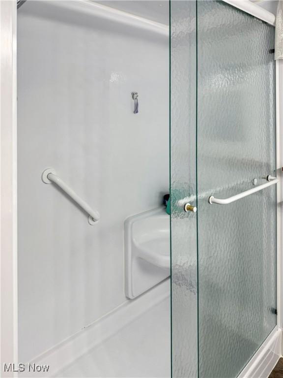 bathroom with an enclosed shower