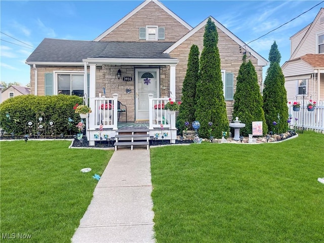 bungalow-style home with a front lawn