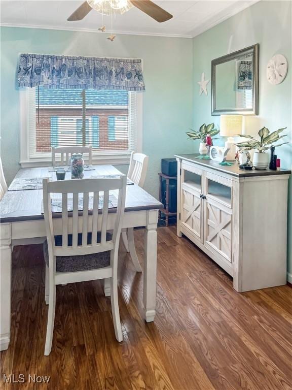 dining space featuring hardwood / wood-style flooring, ceiling fan, ornamental molding, and a wealth of natural light