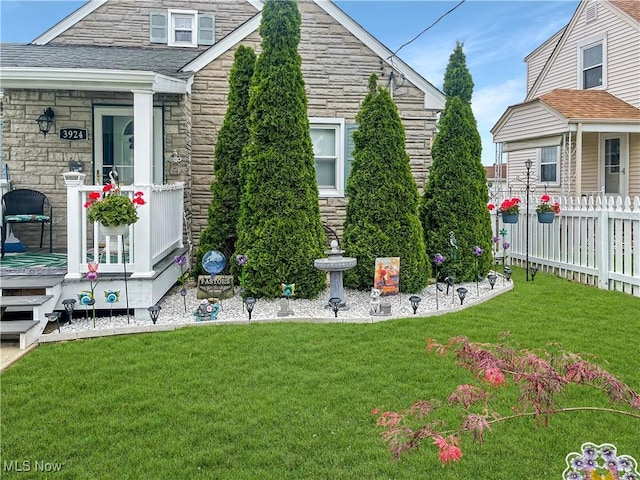 view of side of home with a lawn