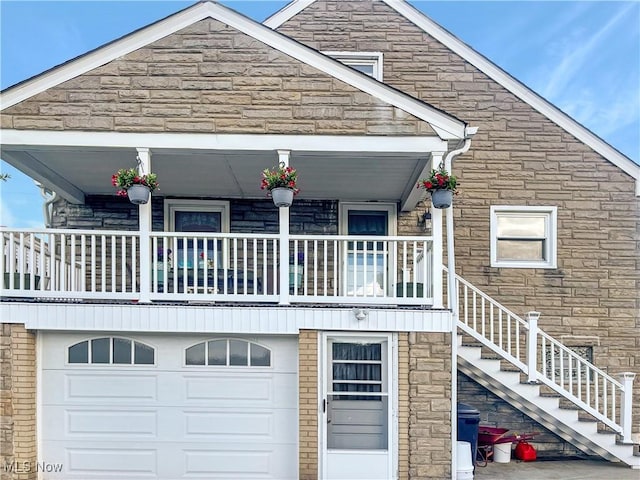 back of house featuring a garage