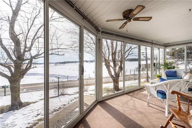 sunroom featuring plenty of natural light and ceiling fan