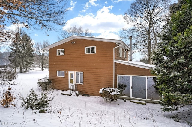 view of snow covered house